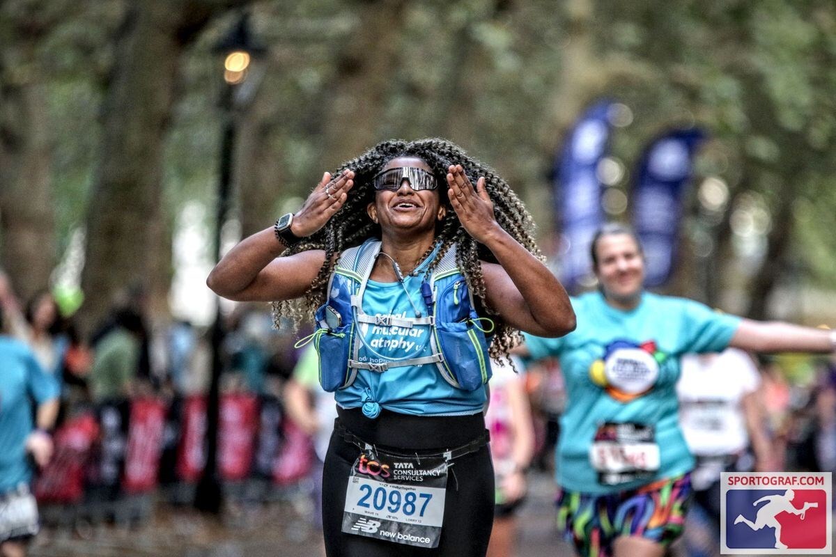 image shows Female Supporter wearing SMA UK running vest
