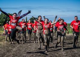 Runners in muddy clothes