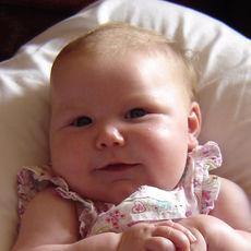 Baby in short sleeved flowery top