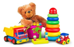 Image shows brown teddy bear with stacking rings, a toy train, toy truck and toy bucket.