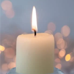 Image shows a white candle.