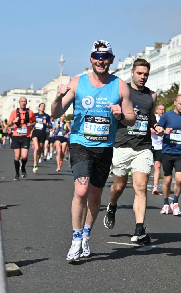 Runner in SMA UK branded vest