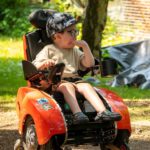 young boy in wizzybug