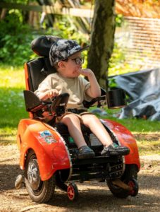 young boy in wizzybug