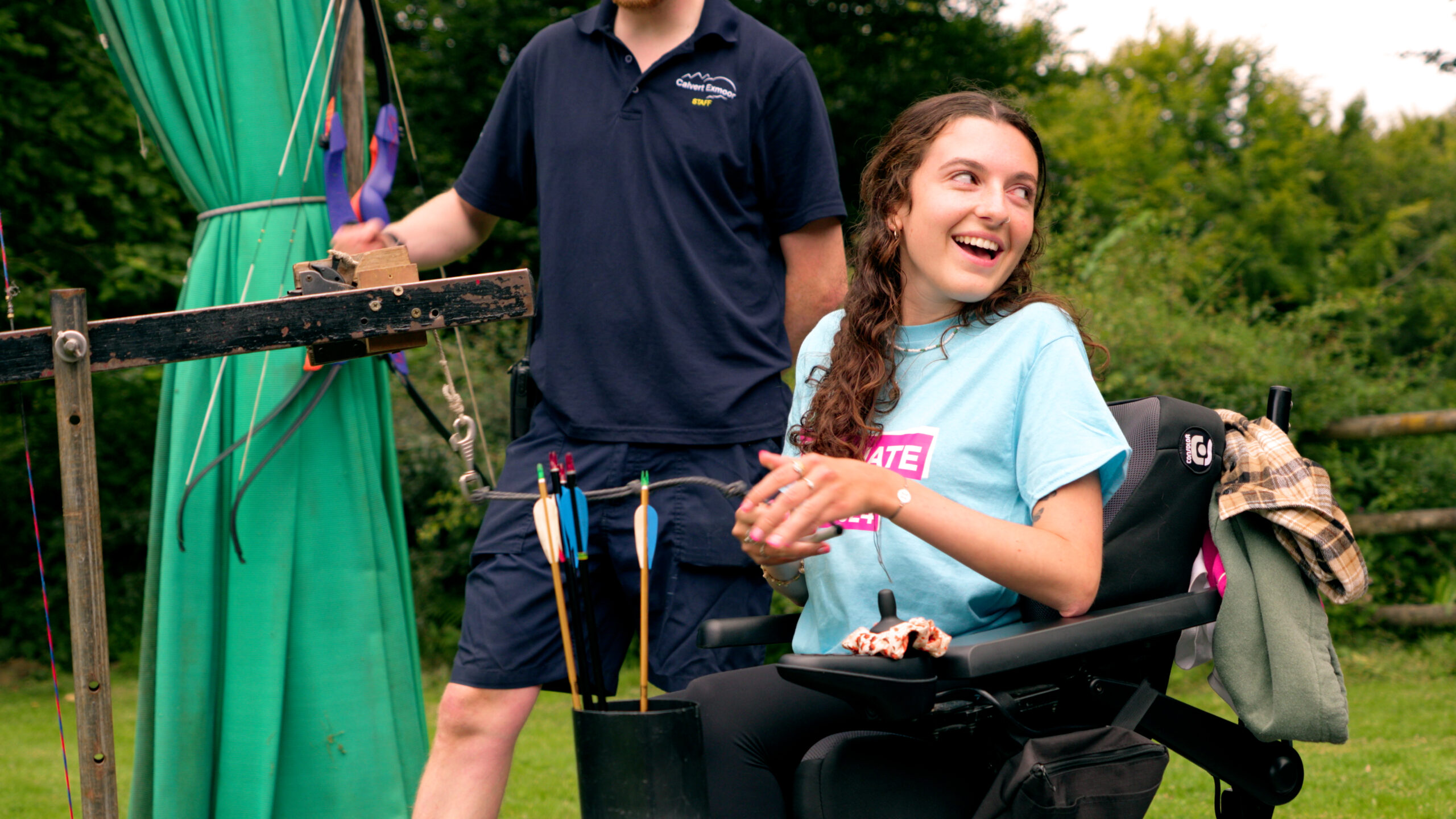 Image shows Molly at SMA UK's Resonate weekend taking part in an archery class