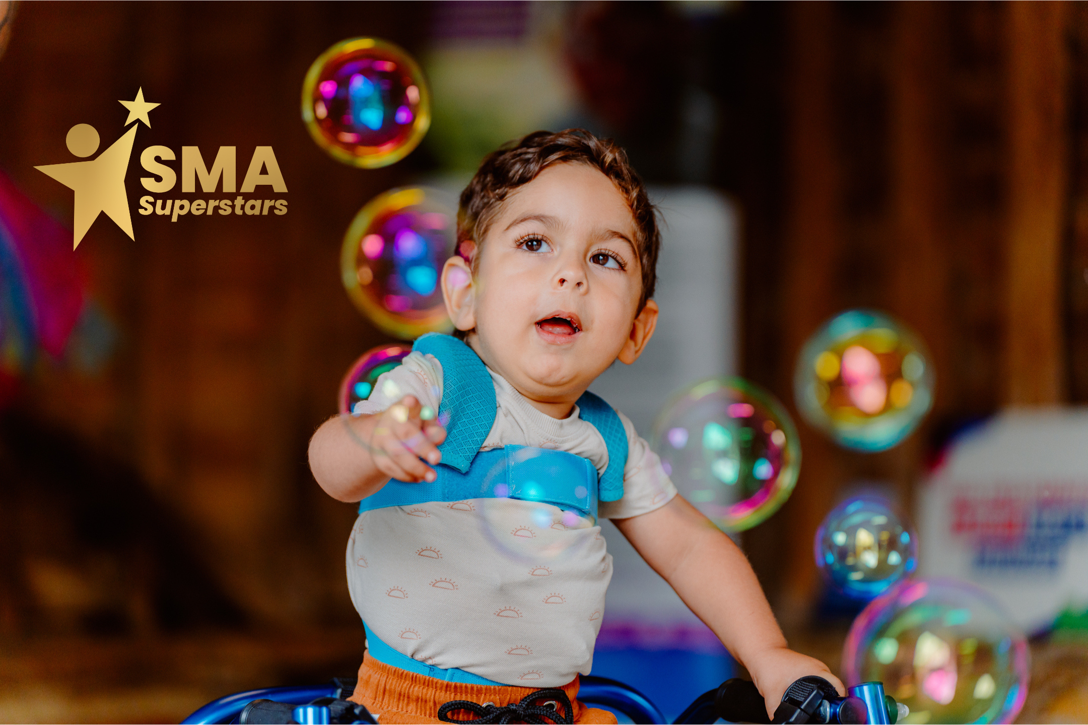 Image shows child surrounded by bubbles